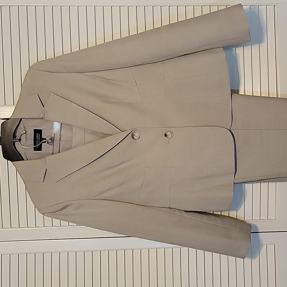 Beige lined jacket with matching lined trousers.  Size 12.
